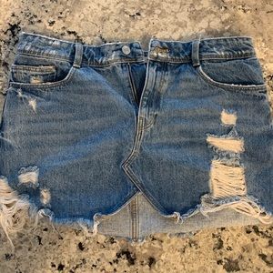 Distressed denim mini skirt